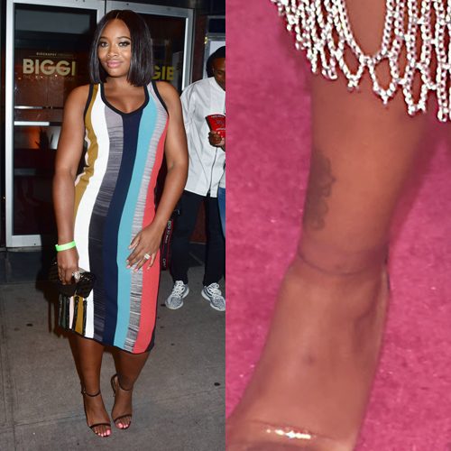 Yandy Smith showing her left ankle tattoo.